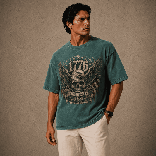 Man wearing a teal USA 250th Anniversary Shirt with a graphic design on a beige background