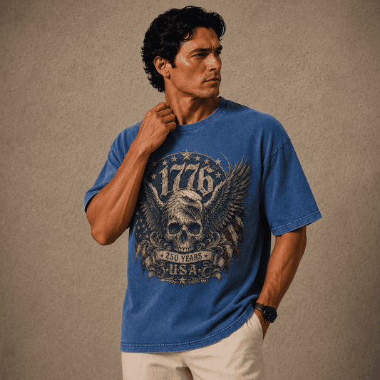 Man wearing a blue USA 250th Anniversary Shirt with a graphic design on a beige background