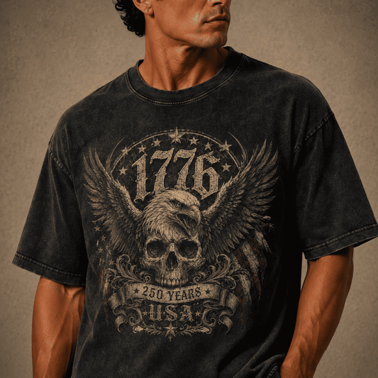 Man wearing a USA 250th Anniversary 1776 Skull Eagle black t-shirt with a graphic design featuring an eagle, skull, and text on a brown background
