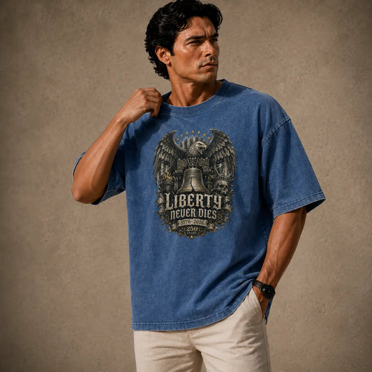 Man wearing a blue t-shirt with an eagle and liberty bell graphic on a beige background