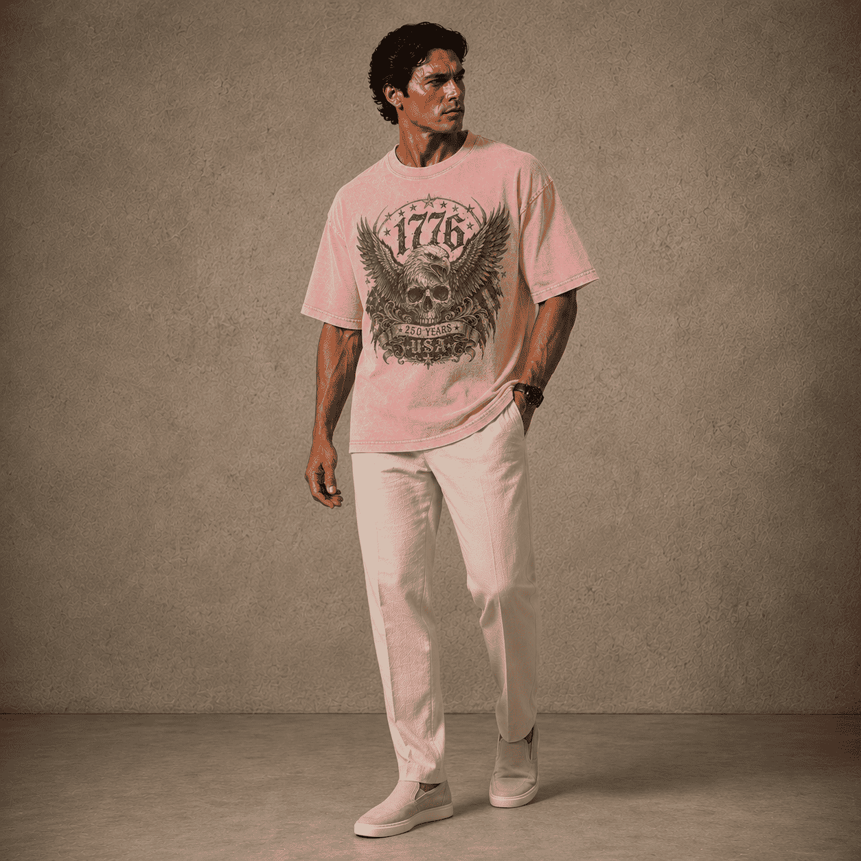 Man wearing a USA 250th Anniversary 1776 Skull Eagle pink t-shirt with a graphic design against a plain background
