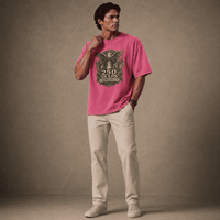 Man wearing a USA 250th Anniversary Shirt pink t-shirt with a graphic design on a plain background