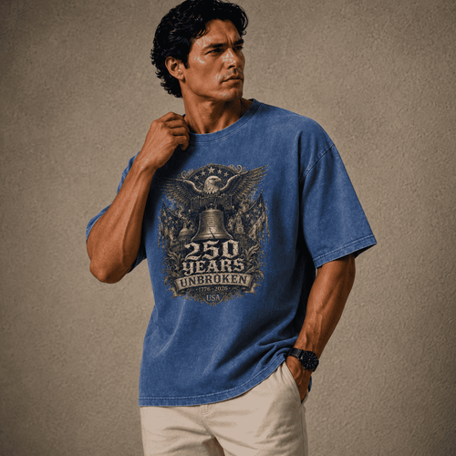 Man wearing a USA 250th Anniversary Shirt blue t-shirt with a graphic design on a beige background