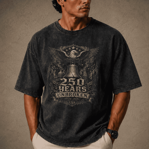 Man wearing USA 250th Anniversary Shirt a black t-shirt with a graphic design on a brown background