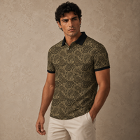 Man wearing a patterned polo shirt against a beige background