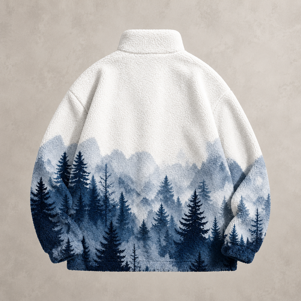 A fleece pullover jacket shown from the back, featuring an off-white upper body that transitions into a blue and navy forest and mountain landscape print on the lower half, set against a textured beige background.