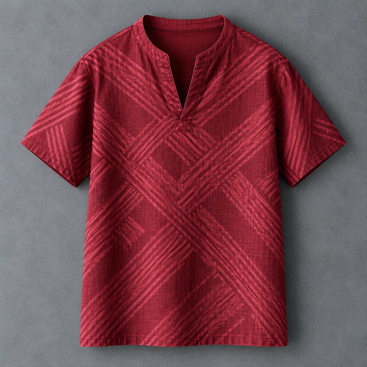 A red short-sleeve men's t-shirt with a textured geometric diagonal stripe pattern, featuring a split mandarin collar and a button placket, laid flat on a gray background.