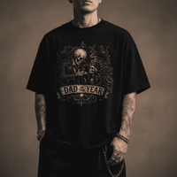 Black t-shirt with a graphic design and text worn by a person on a dark background