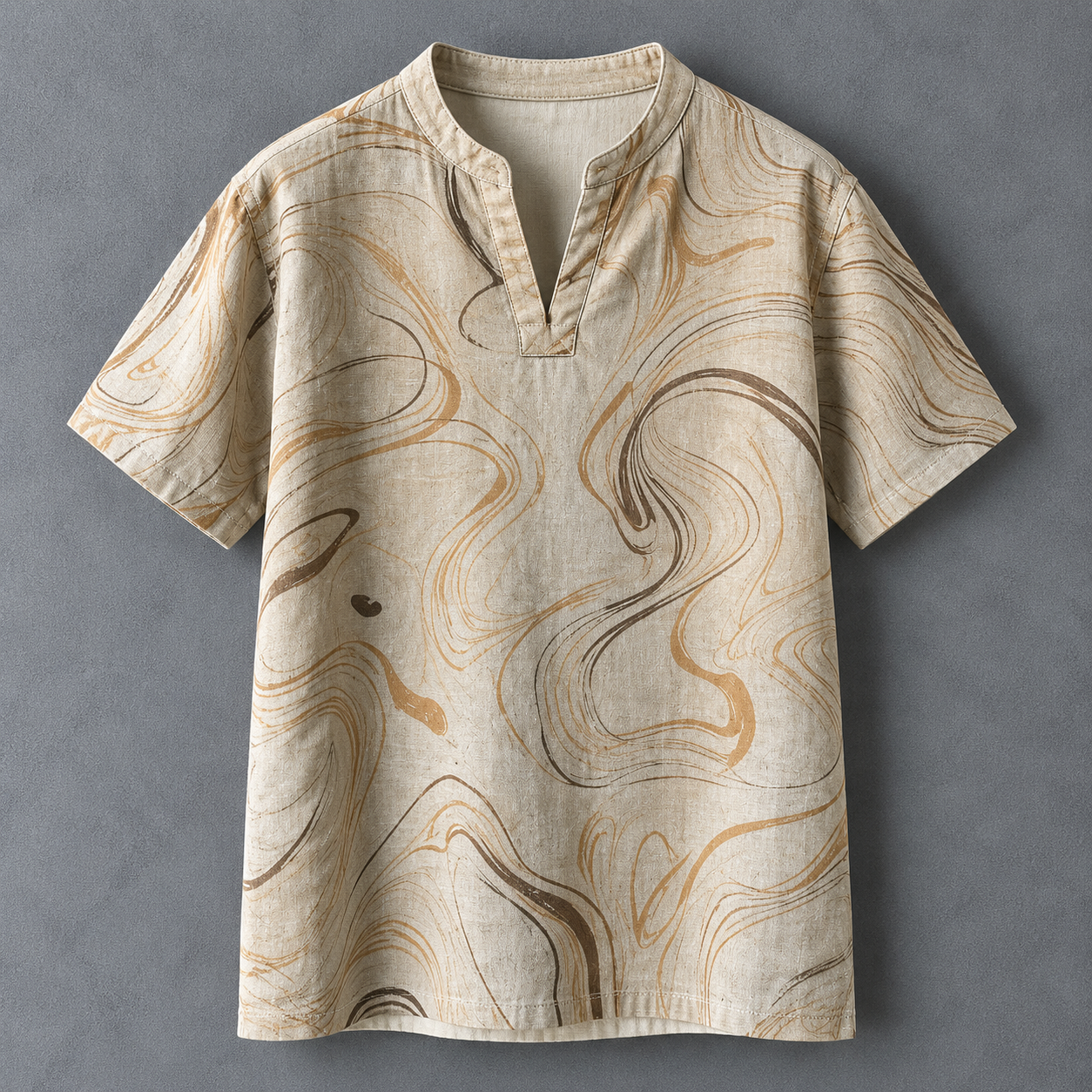 A short-sleeve linen tunic shirt with a split collar, featuring an abstract marbled pattern in beige, brown, and tan on a textured gray background.