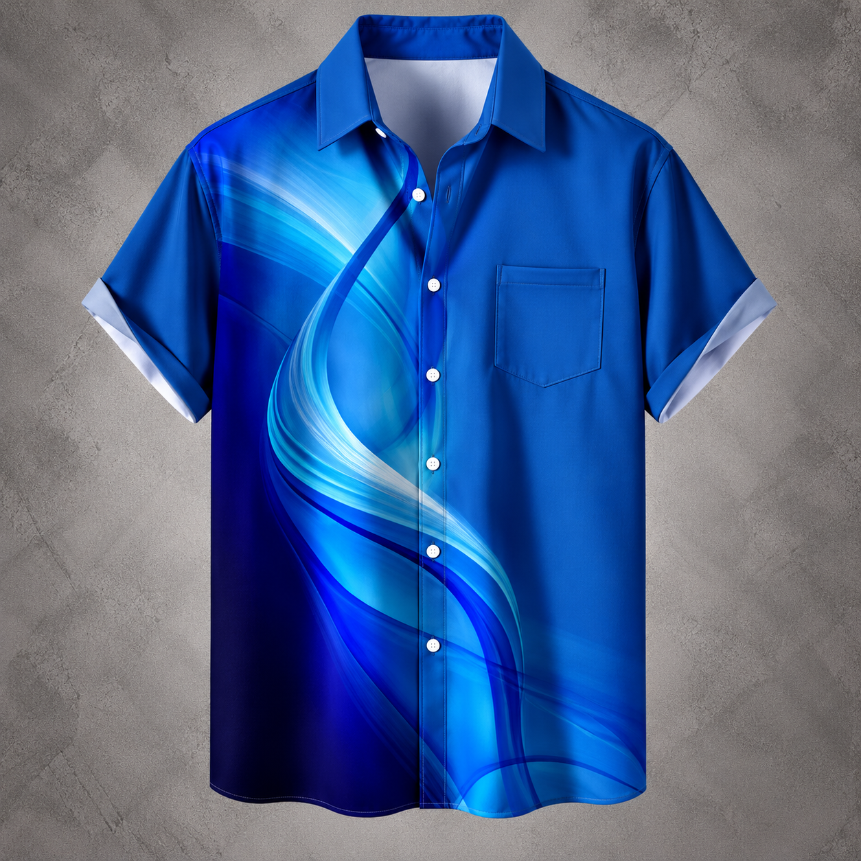 A short-sleeve button-up camp shirt with a vibrant blue and light blue abstract wave graphic print, displayed against a textured gray background.