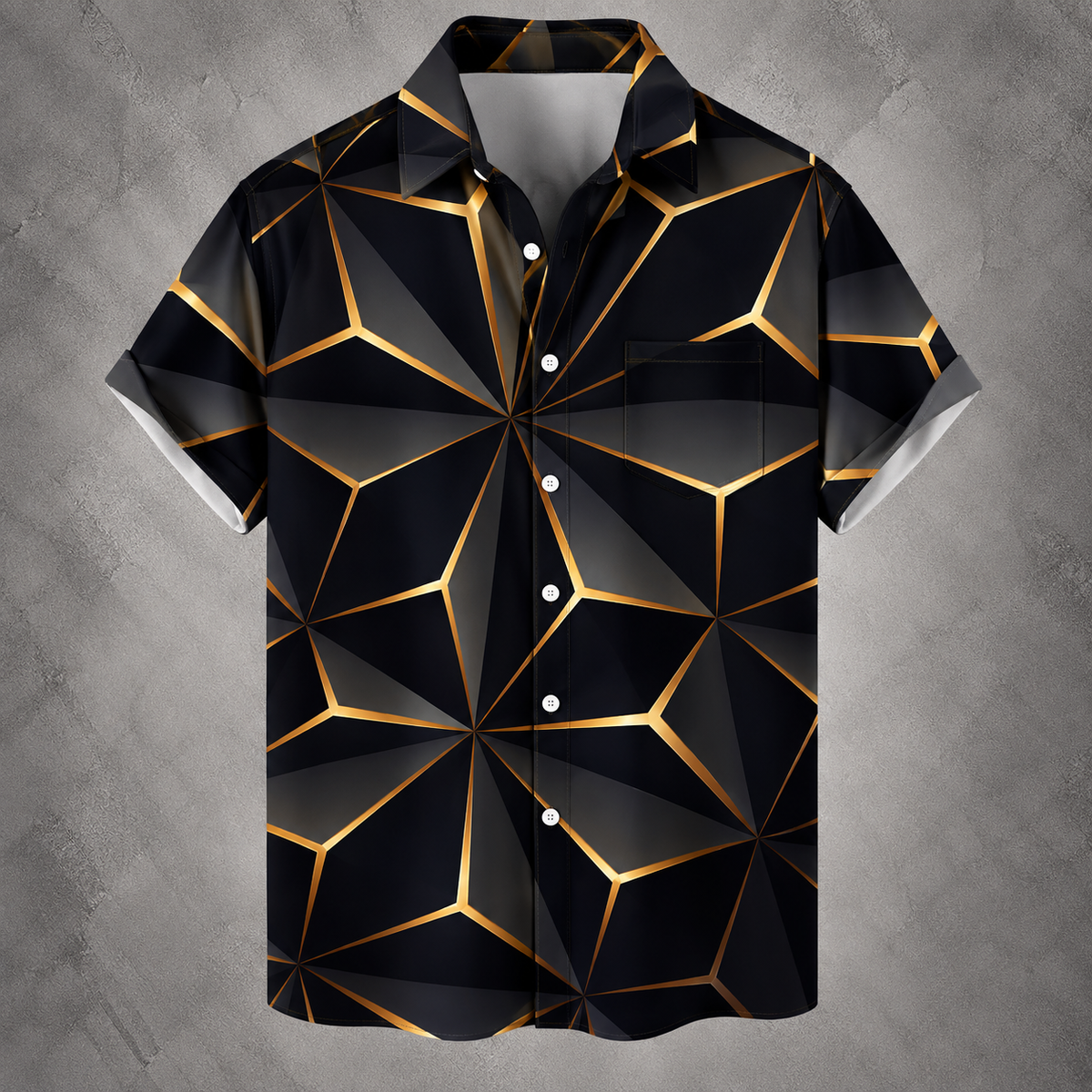 A short-sleeve button-up camp shirt with a black and dark gray geometric faceted pattern outlined in metallic gold, displayed against a textured gray background.