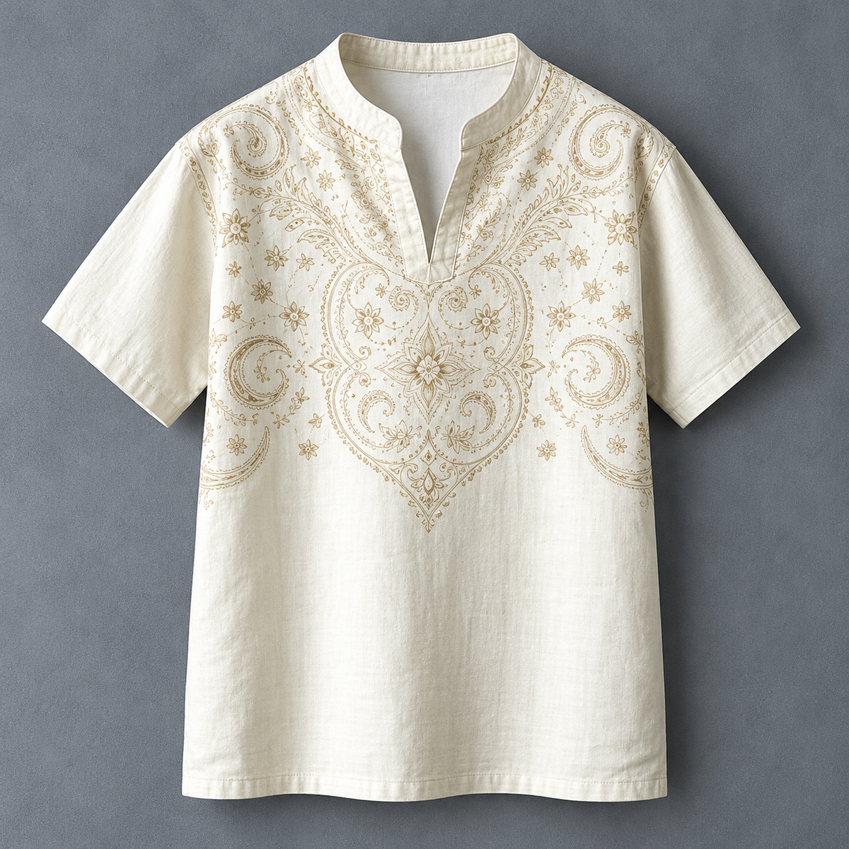 An off-white short-sleeve linen tunic shirt with a split collar and intricate gold embroidery on the chest, displayed flat against a textured gray background.