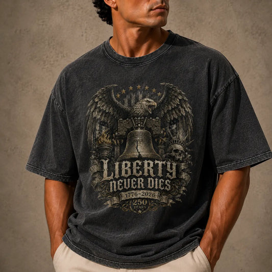 Man wearing a USA 250th Anniversary USA Shirt black t-shirt with an eagle graphic and 'Liberty Never Dies' text on a beige background