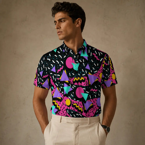 Man wearing a colorful geometric patterned shirt against a beige background