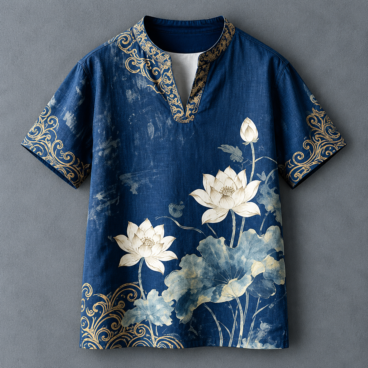 A men's short-sleeve tunic-style shirt in dark blue with a watercolor lotus print in white and light blue, featuring gold ornamental scrollwork trim along the collar, sleeve cuffs, and lower hem, displayed flat against a textured gray background.