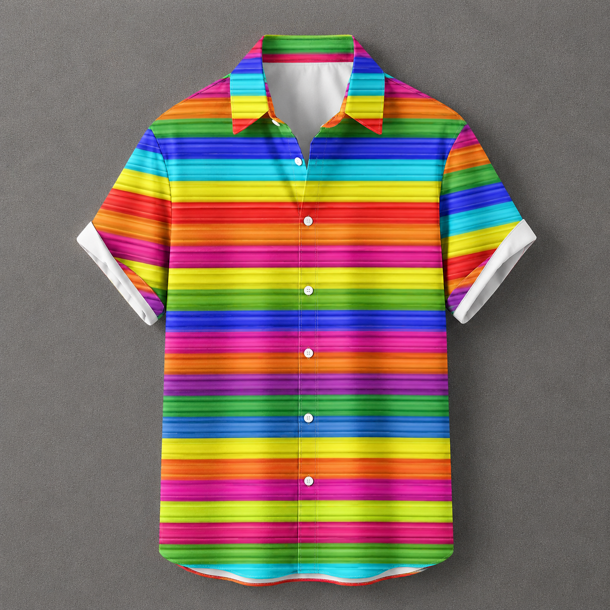 A short-sleeve button-up shirt with a vibrant rainbow striped pattern, featuring white button details and white inner collar lining, displayed against a solid gray background.
