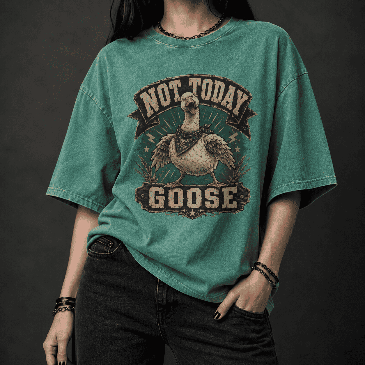Person wearing a green t-shirt with 'Not Today Goose' graphic design on a dark background