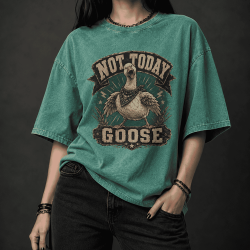 Person wearing a green t-shirt with 'Not Today Goose' graphic design on a dark background