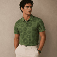 Man wearing a green patterned polo shirt against a beige background