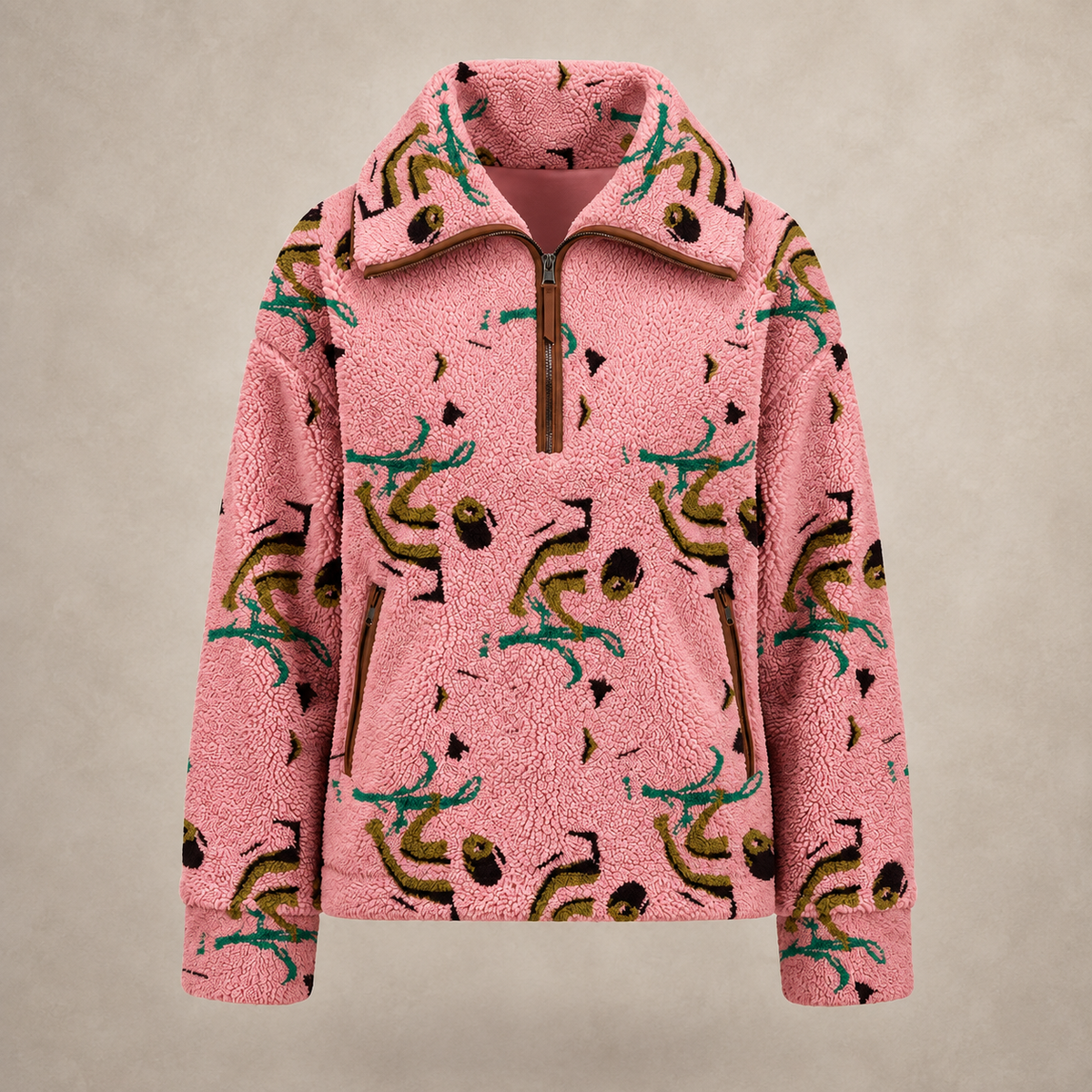 A pink sherpa fleece half-zip pullover jacket featuring an all-over abstract print in teal, olive green, and black, displayed against a neutral beige background.