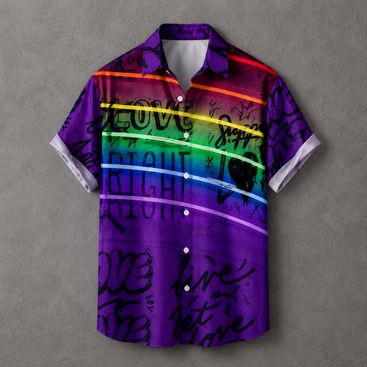 A short-sleeve button-up camp shirt with a vibrant purple base, rainbow stripe accents, and black graffiti-style text, displayed flat against a textured gray background.