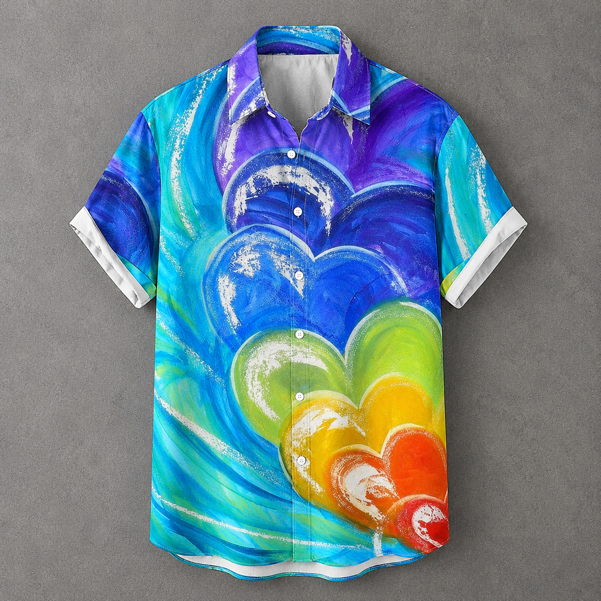 A short-sleeve button-up shirt with a vibrant, colorful abstract heart design in shades of blue, purple, green, yellow, orange, and red, displayed flat against a textured gray background.
