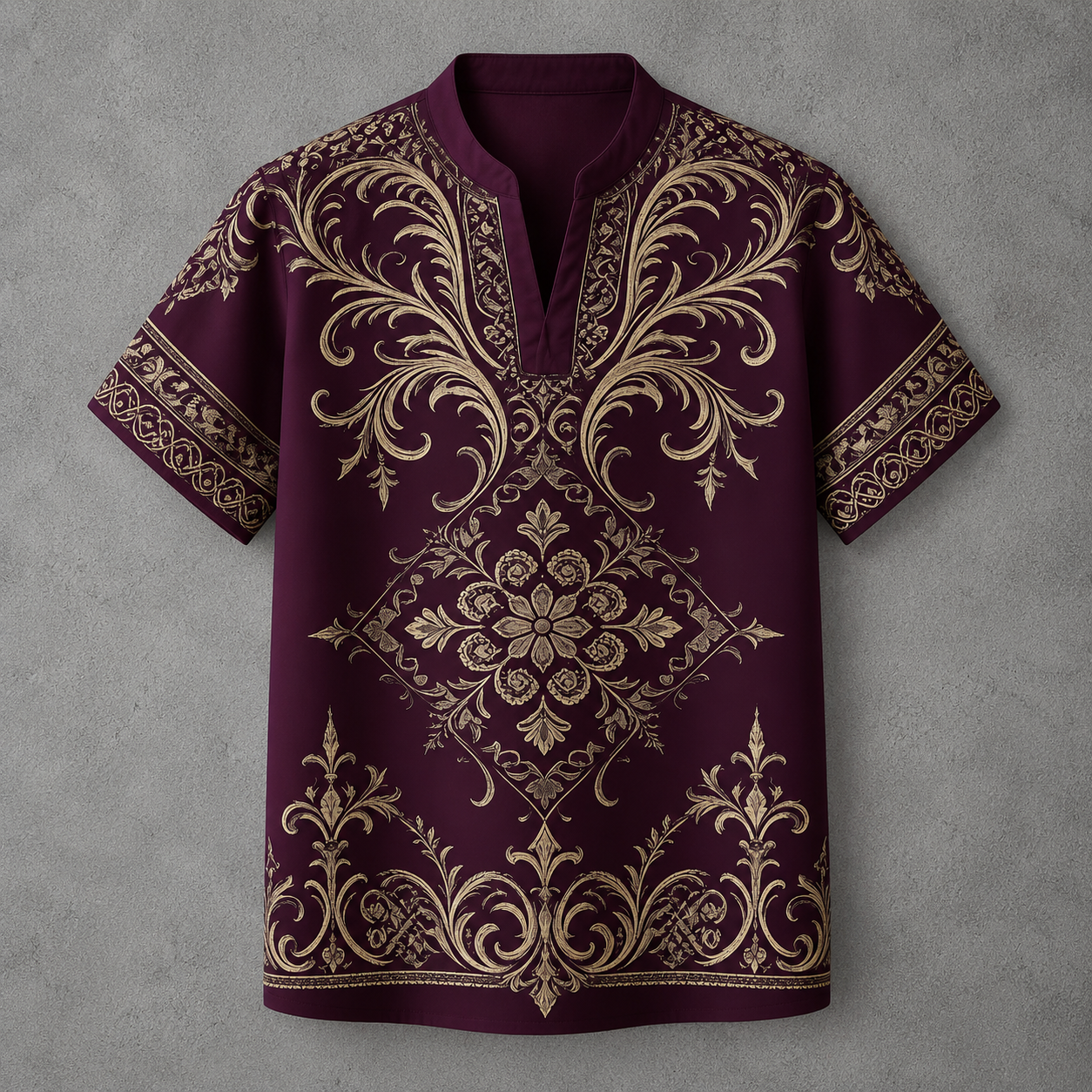 A short-sleeve polo shirt in deep burgundy with an intricate gold baroque-style damask pattern, laid flat against a textured gray background.