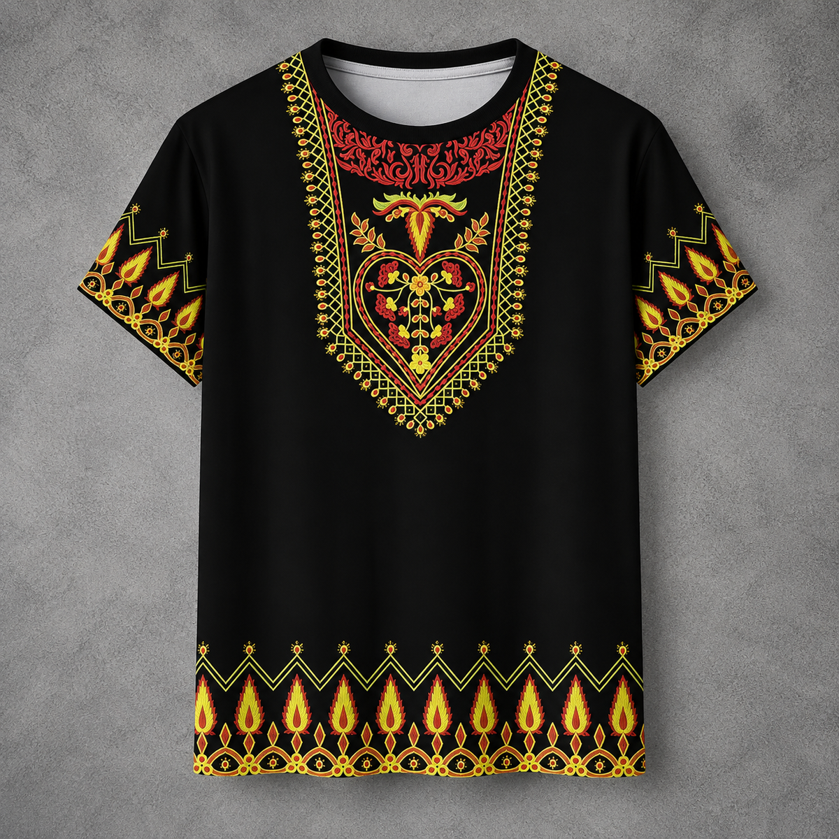 A black short-sleeve t-shirt with an intricate, colorful African dashiki-style print featuring red, yellow, and green patterns on the chest and sleeves, displayed against a textured gray background.