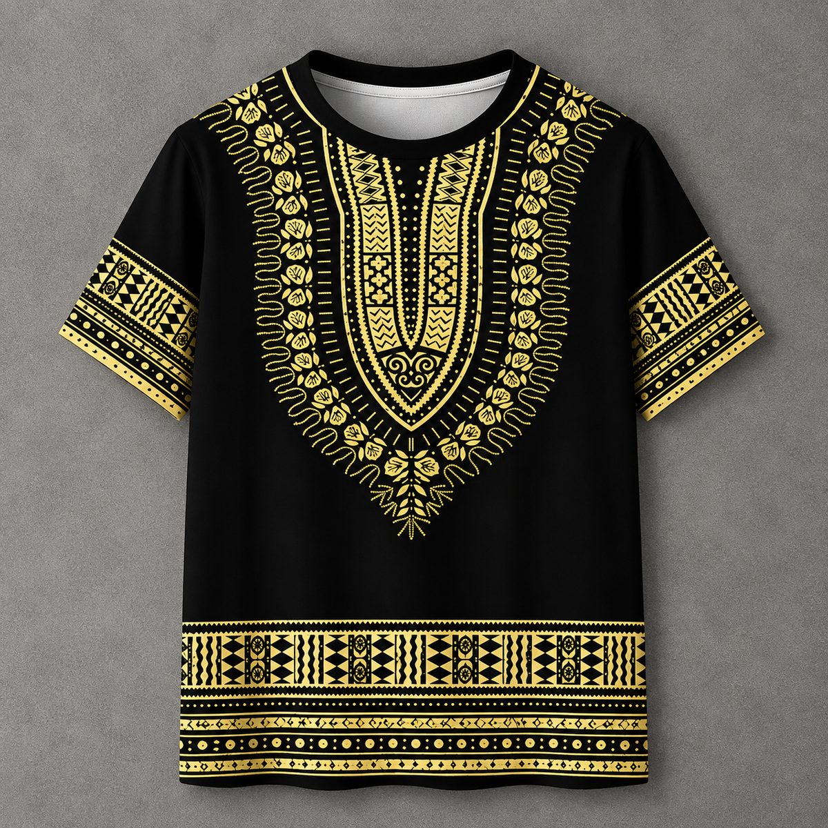 A black short-sleeve t-shirt with an all-over gold African dashiki pattern, featuring a V-neckline, patterned sleeves, and a decorative border at the bottom, displayed flat against a textured gray background.