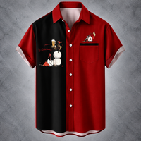 A short-sleeve button-up camp shirt with a split design: the left side is black with a graphic print of a person carrying white lanterns, and the right side is red with a chest pocket and a small graphic on the pocket. The collar, placket, and sleeve cuffs are solid red, and the inner collar lining is light pink.