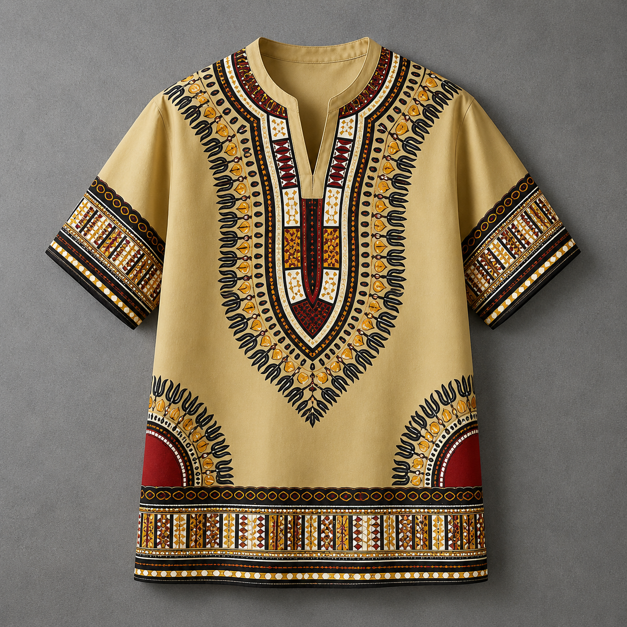 A short-sleeve dashiki tunic shirt in beige with intricate black, gold, and red African wax print patterns, displayed flat against a neutral gray background.
