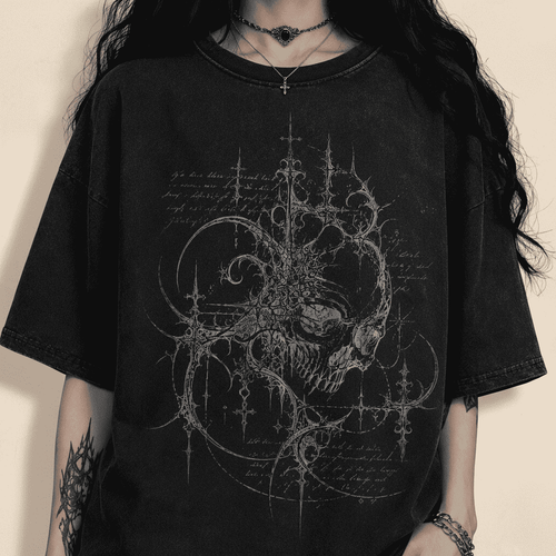 Person wearing a black t-shirt with intricate design on a dark background