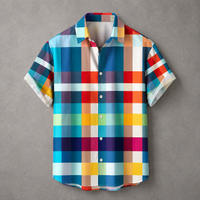 A short-sleeve button-up shirt with a colorful plaid pattern, laid flat on a textured gray background.
