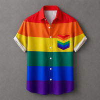 A short-sleeve button-up shirt with horizontal rainbow stripes in red, orange, yellow, green, blue, and purple, featuring a matching rainbow-striped chest pocket and white button closures, displayed against a textured gray background.