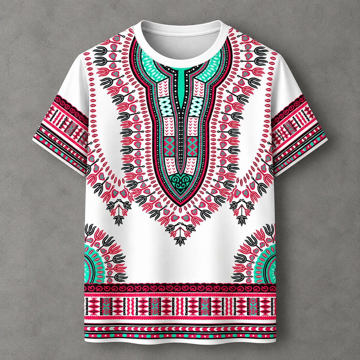 A white short-sleeve t-shirt with a vibrant African dashiki print in pink, teal, and black, displayed flat against a textured gray background.