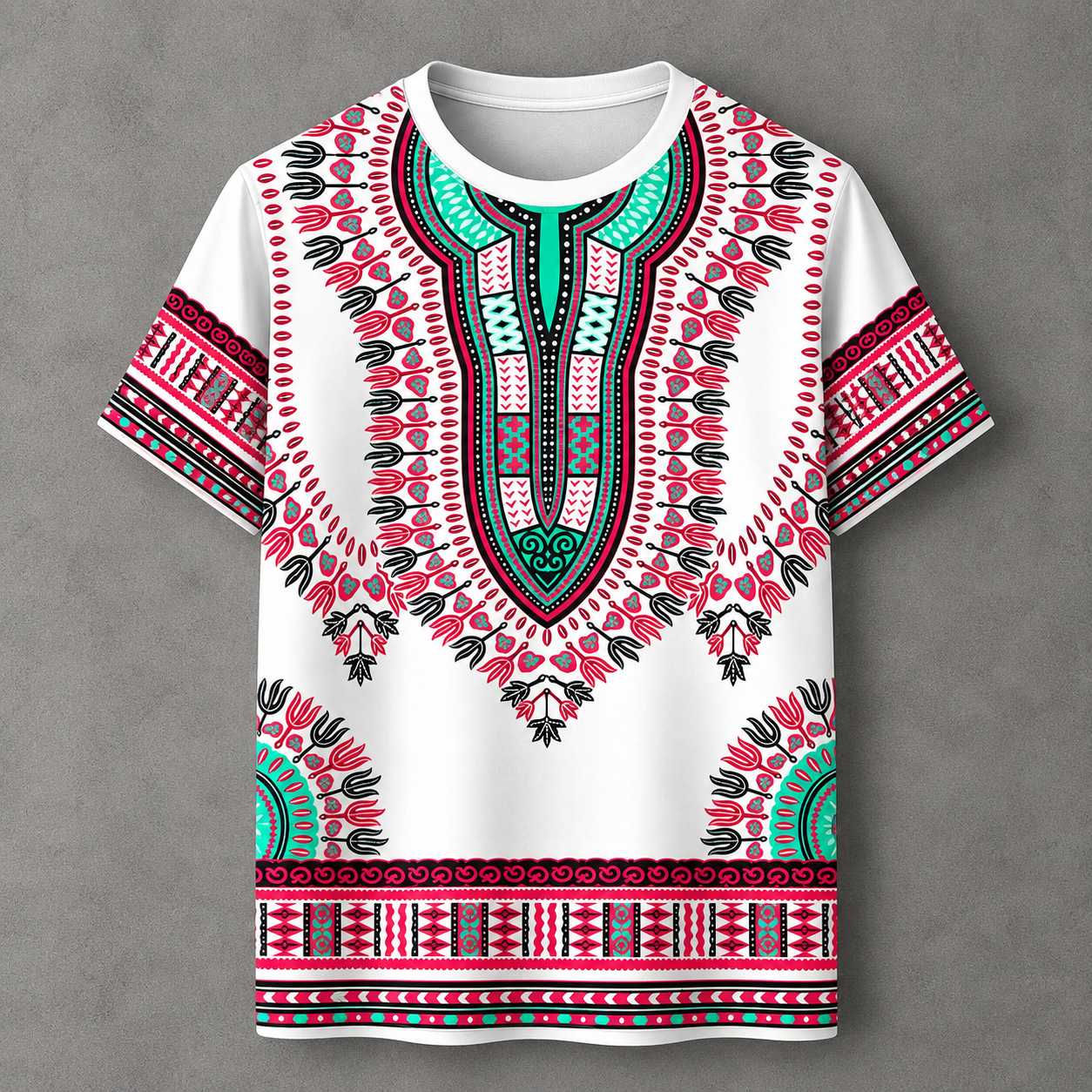 A white short-sleeve t-shirt with a vibrant African dashiki print in pink, teal, and black, displayed flat against a textured gray background.