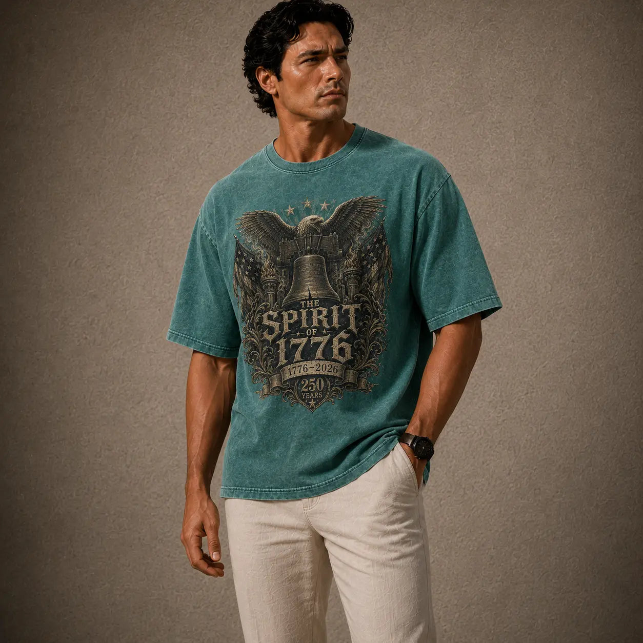 Man wearing a teal t-shirt with 'The Spirit of 1776' design against a brown background