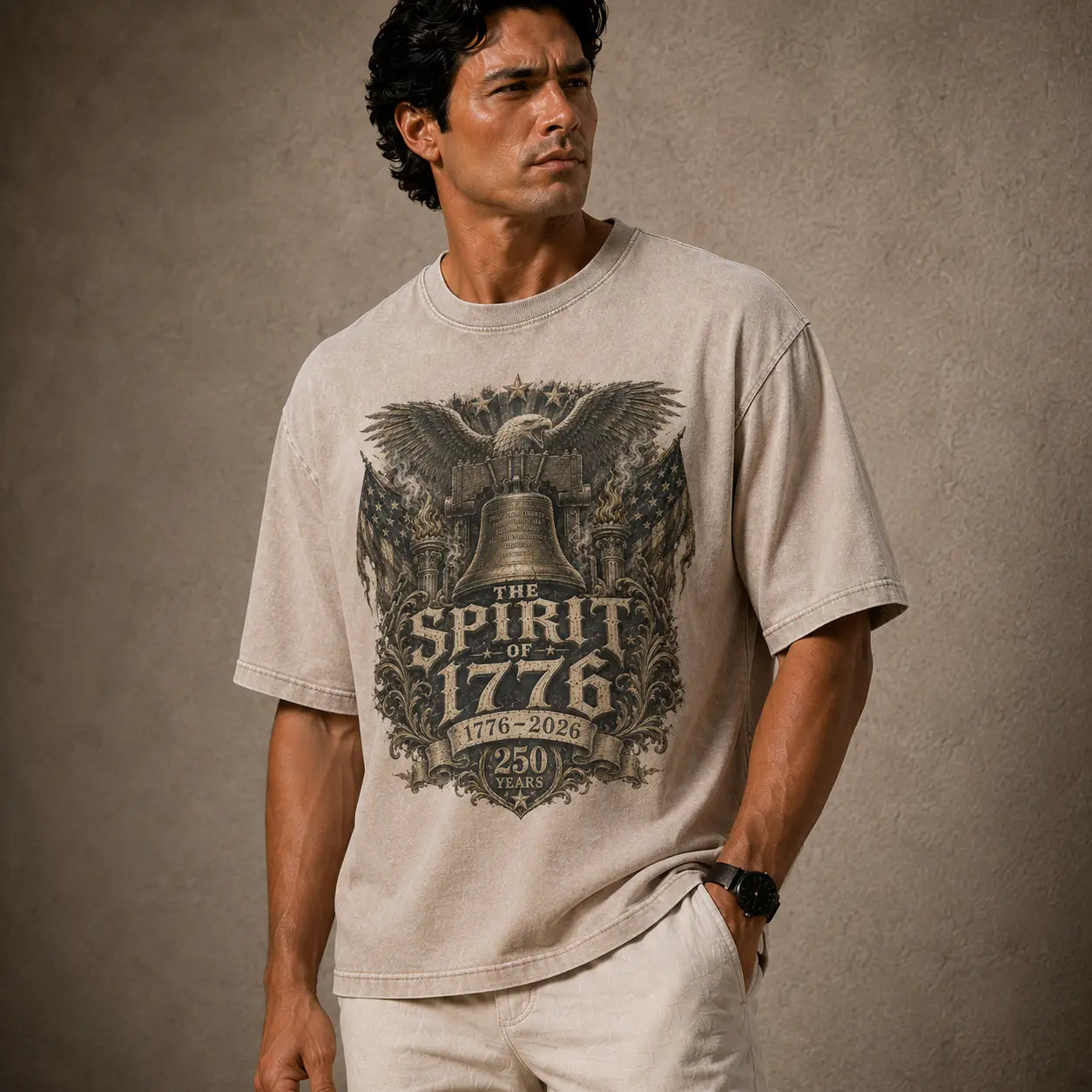 Man wearing a t-shirt with 'The Spirit of 1776' design on a textured brown background