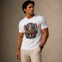 Man wearing a white t-shirt with a colorful graphic design on a beige background