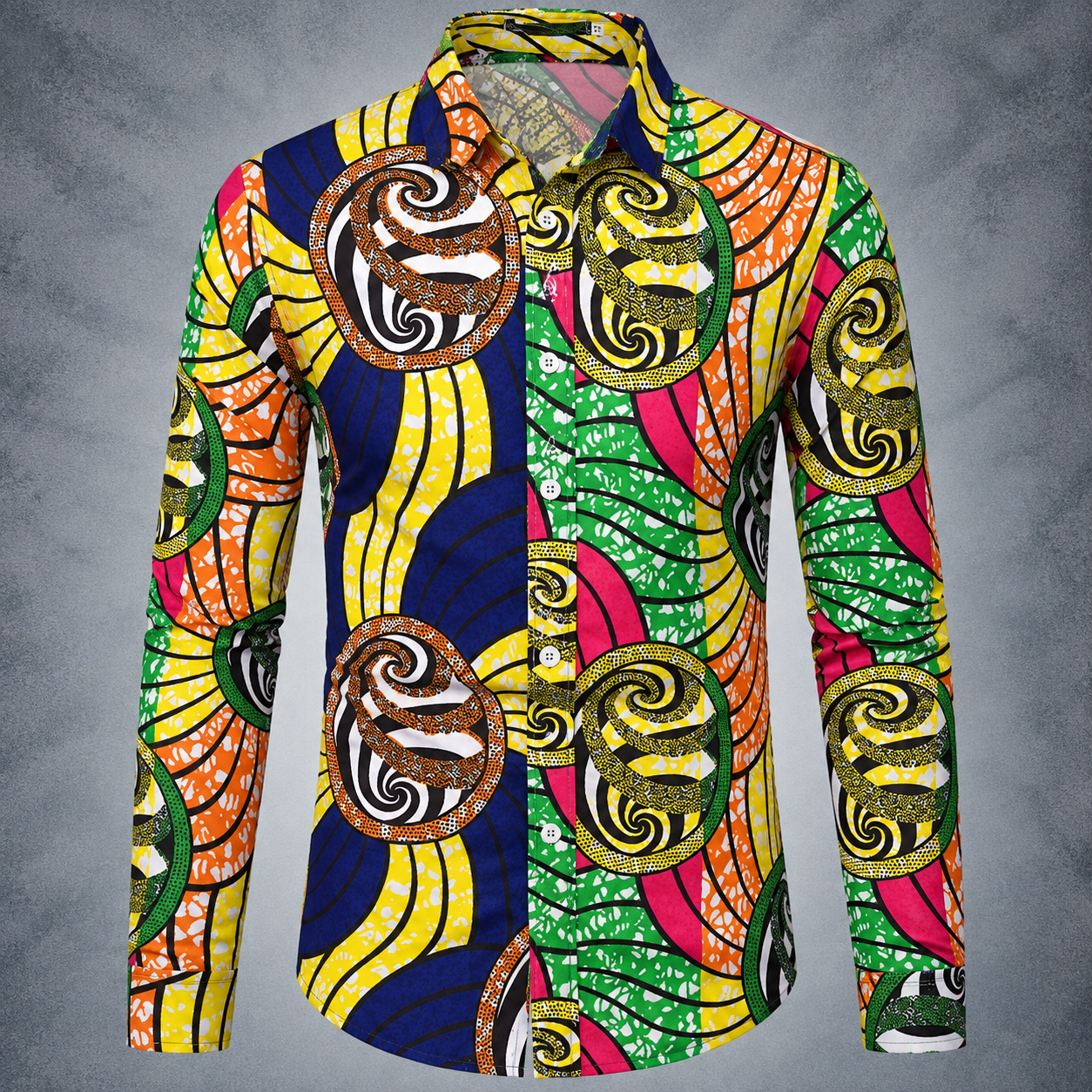 A long-sleeve button-up shirt with a vibrant, multicolor African wax print pattern featuring bold swirls and waves in yellow, green, pink, orange, and navy blue, set against a textured gray background.