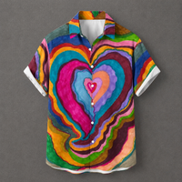 A short-sleeve button-up camp shirt with a vibrant, multicolored psychedelic heart pattern, displayed flat against a neutral gray background.