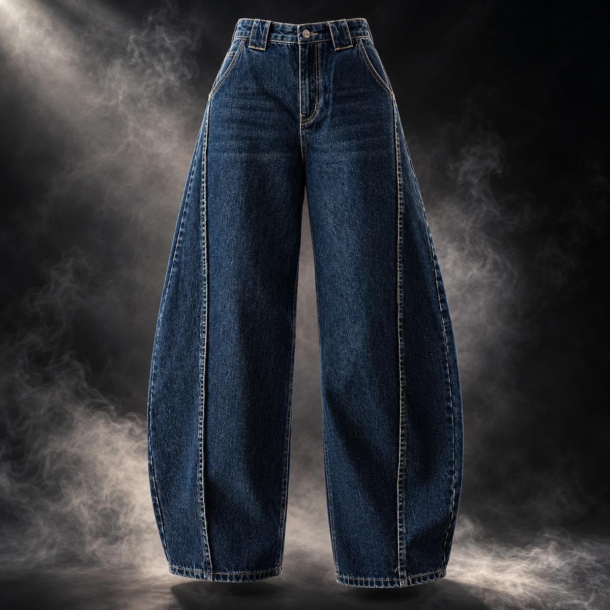 A pair of dark blue wide-leg denim jeans with prominent contrast stitching, displayed against a dramatic dark background with smoke effects.