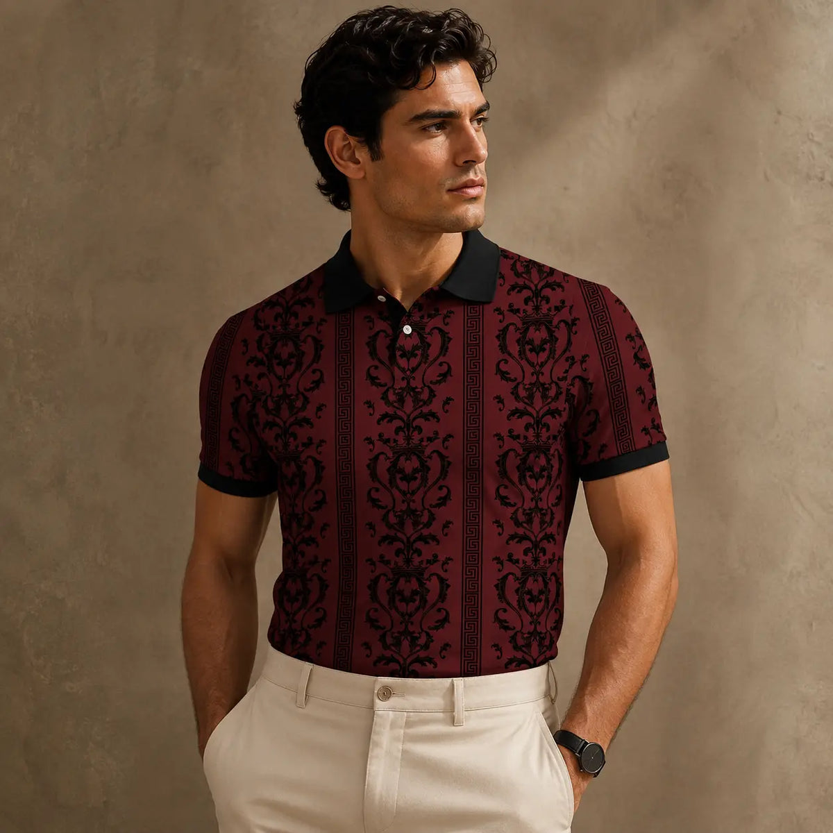 Man wearing a patterned polo shirt against a beige wall