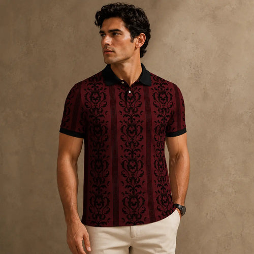 Man wearing a patterned maroon shirt against a beige background