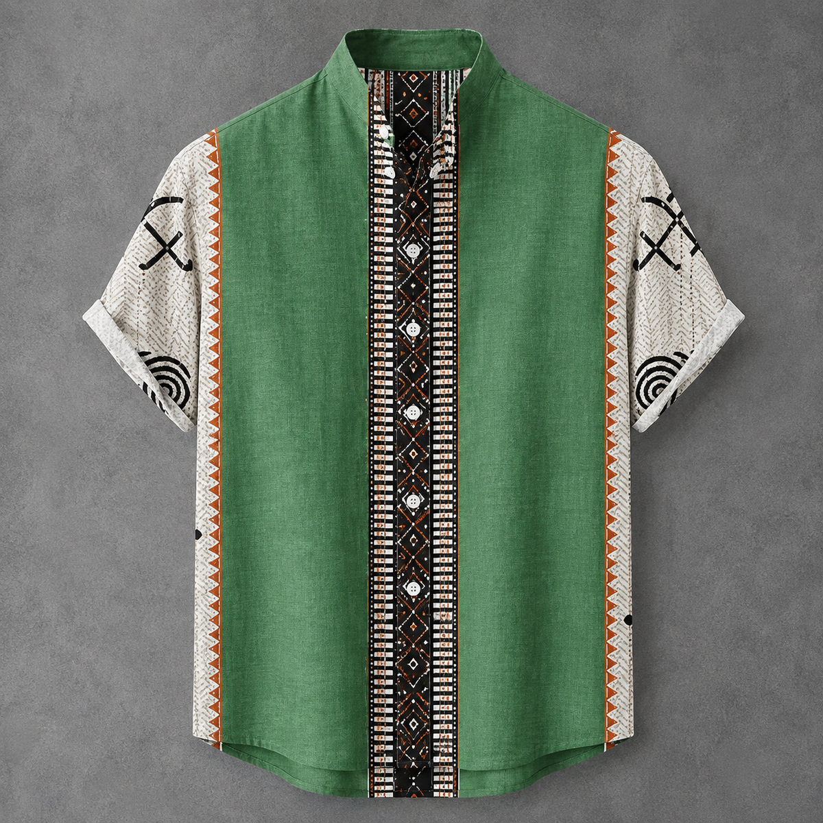 A short-sleeve button-up shirt with a green body, white patterned sleeves, and a central black, white, and orange geometric patterned placket, displayed flat against a gray background.