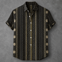 A short-sleeve button-up shirt with a black base and vertical stripes of white dots and gold accents, featuring small gold snowflake motifs on the sides, laid flat on a textured gray background.