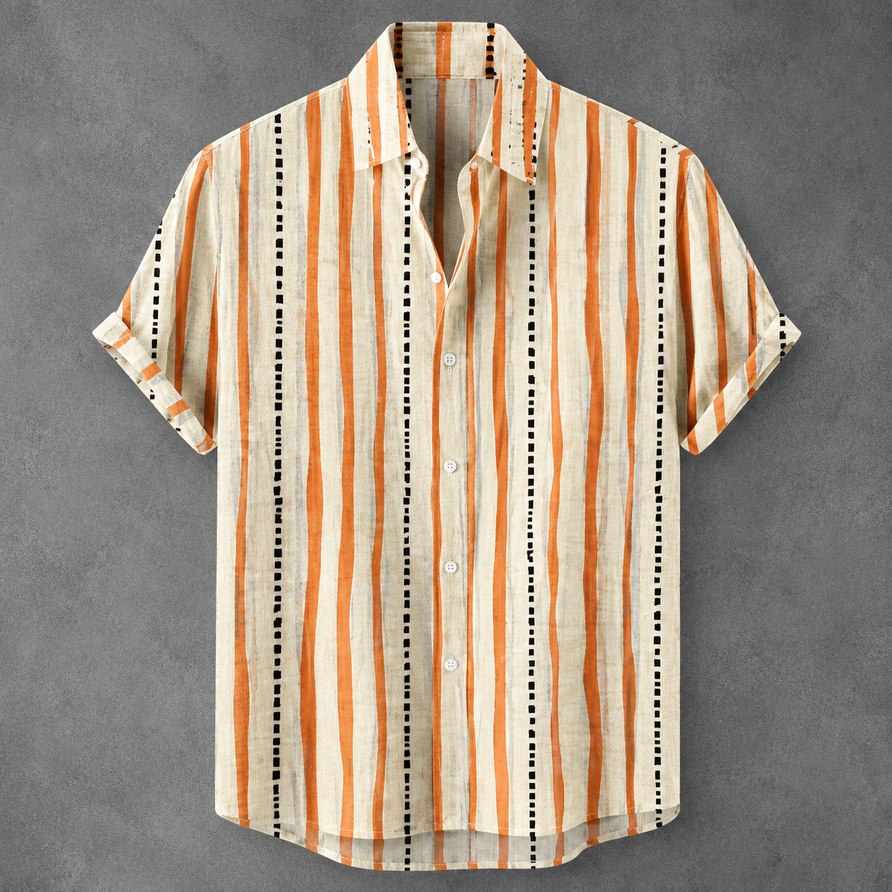 A short-sleeve button-up shirt with vertical stripes in orange, black, and cream, laid flat on a textured gray background.