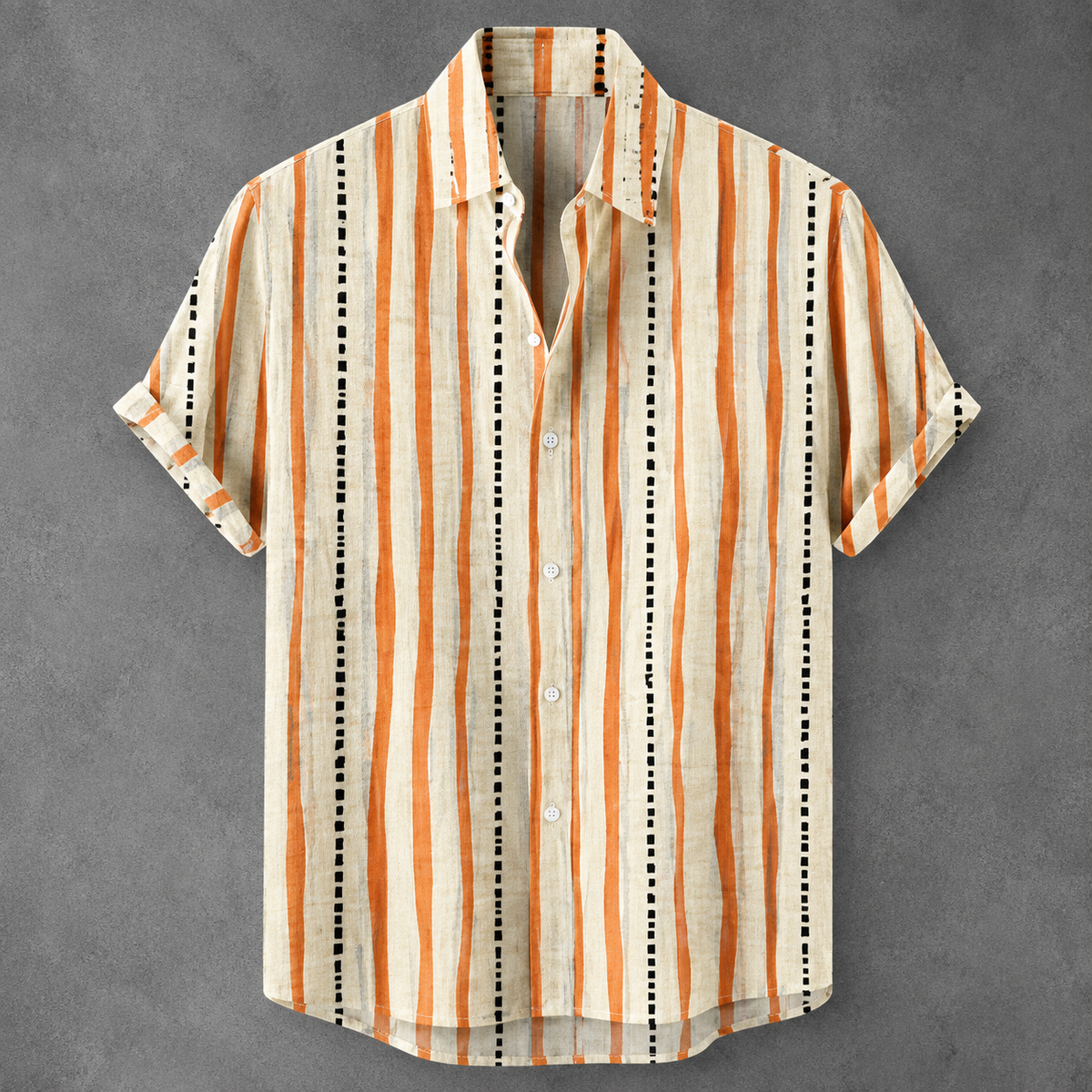 A short-sleeve button-up shirt with vertical stripes in orange, black, and cream, laid flat on a textured gray background.
