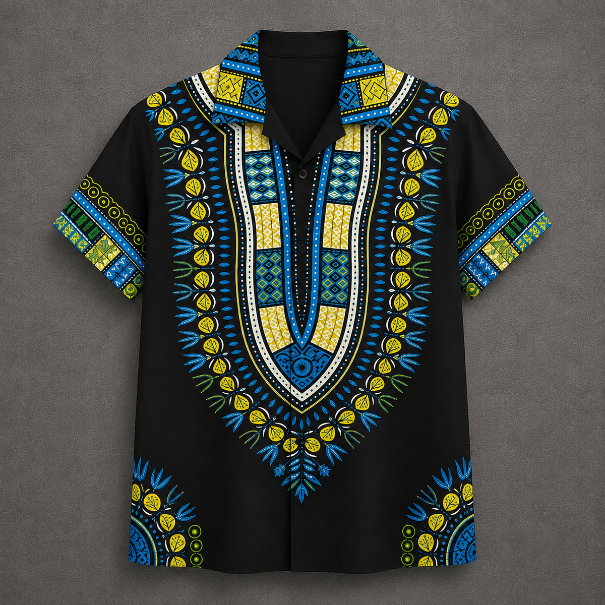 A short-sleeve button-up shirt with a black base and vibrant African dashiki print in blue, yellow, and green, displayed flat against a textured gray background.