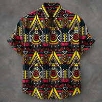 A short-sleeve button-up camp shirt with a bold, colorful geometric tribal pattern featuring yellow, red, black, and white, displayed against a textured gray background.